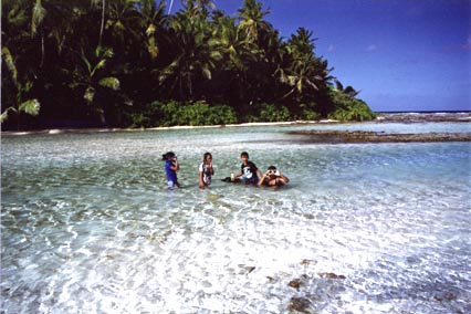 Children playing in a lagoon